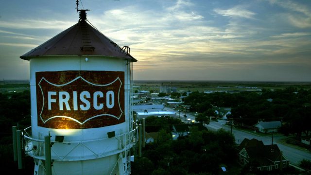 July 30, 2003 --The Frisco water tower looms over downtown at dusk as one of the city's most...