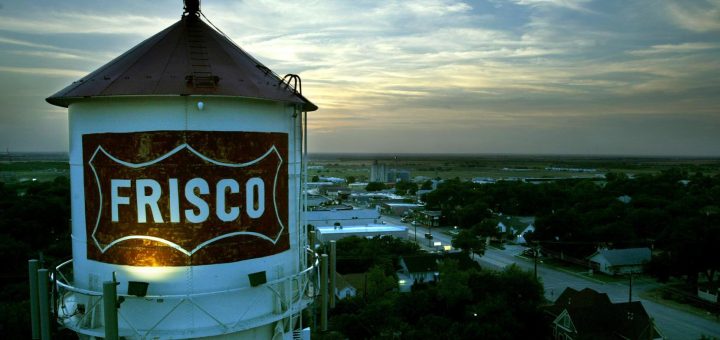 July 30, 2003 --The Frisco water tower looms over downtown at dusk as one of the city's most...